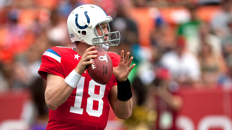 Peyton Manning presumably prepares to bonk some guy in the head as he plays in the 2011 Pro Bowl. (Photo: Getty Images)